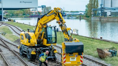 Road/rail excavator on port rail track