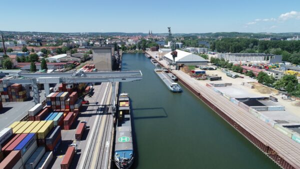 Aerial phot of port basin with ships and cranes